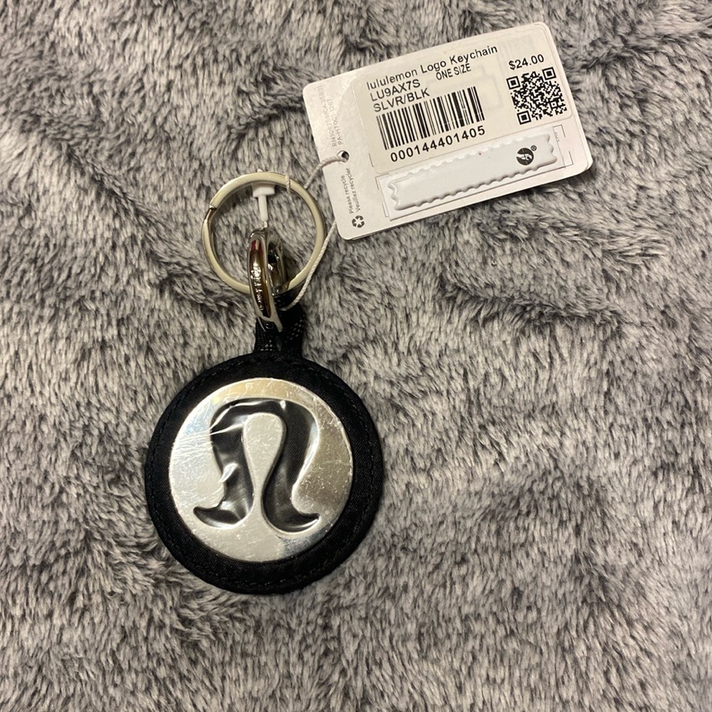 NWT Lululemon large logo key chain silver/black, still has protective plastic on